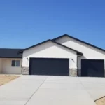 brand new modern construction with 3 car garage white and black