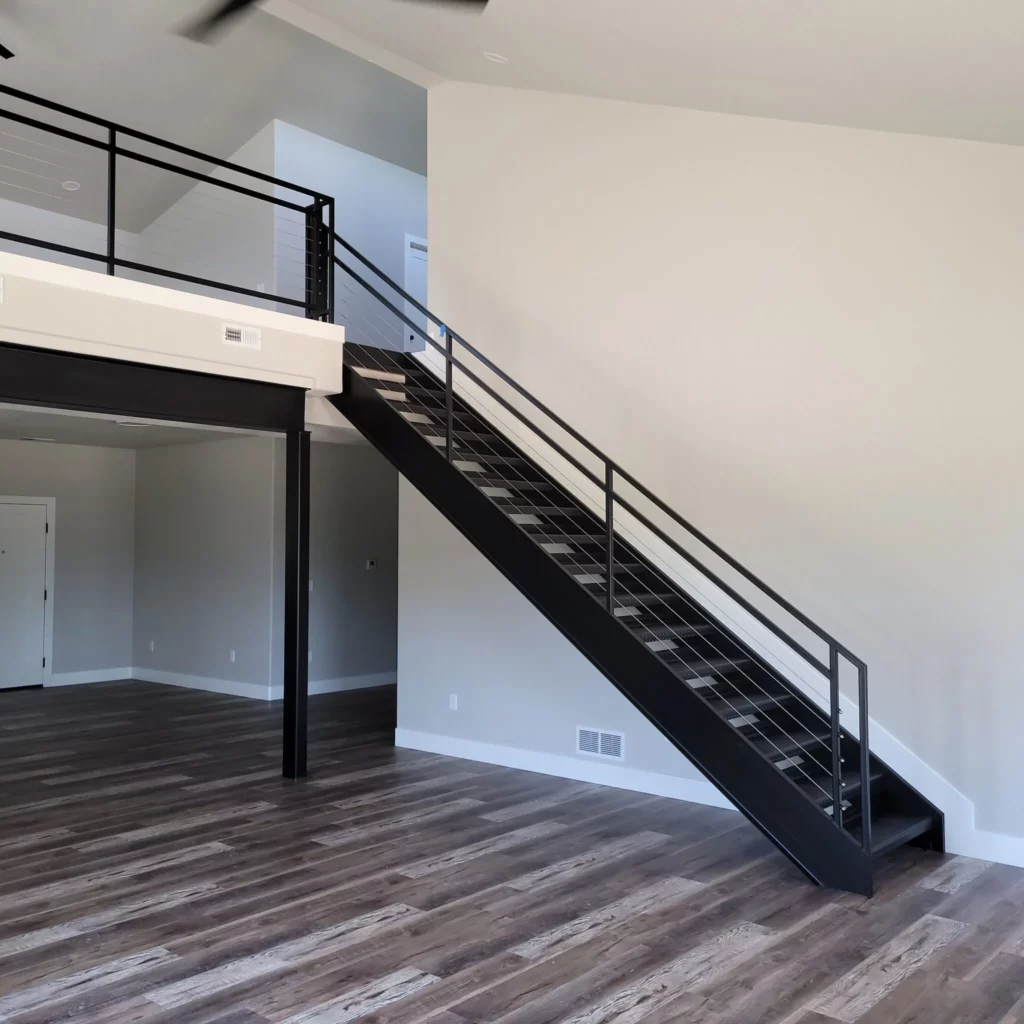 modern home with lvp luxury vinyl plank flooring with black stairs
